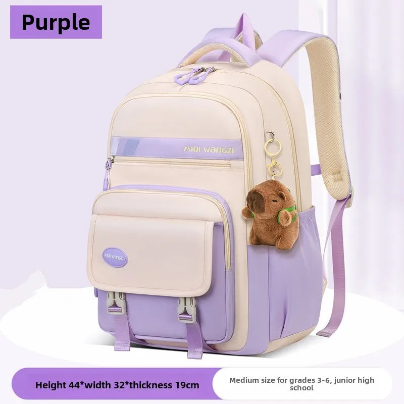 Children's school backpack with cartoon pendant