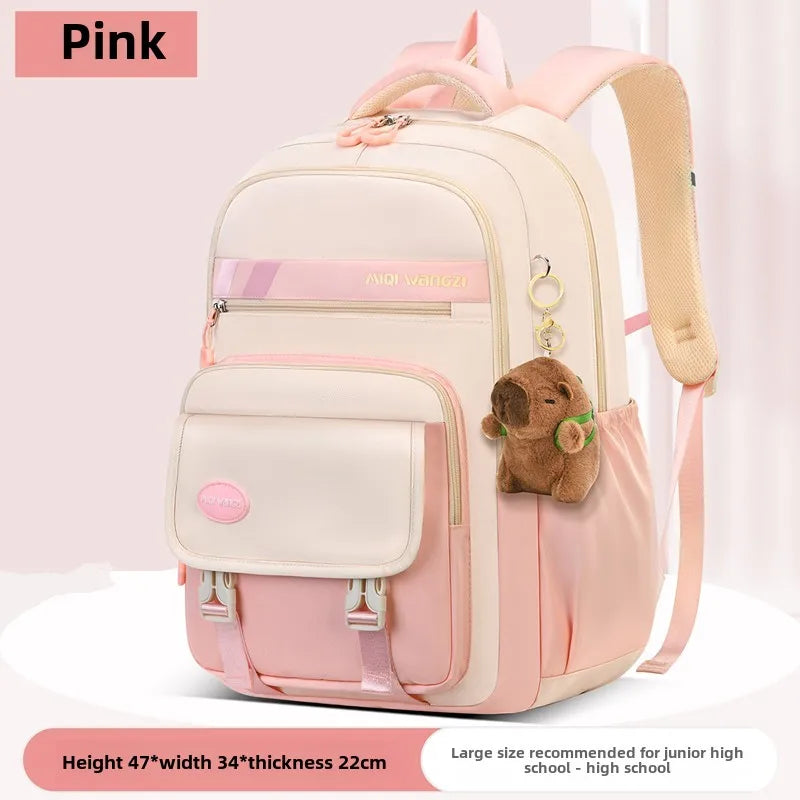 Children's school backpack with cartoon pendant