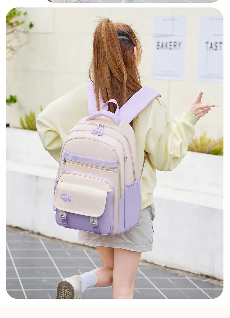 Children's school backpack with cartoon pendant