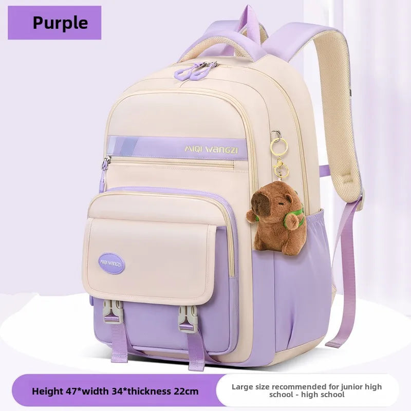 Children's school backpack with cartoon pendant