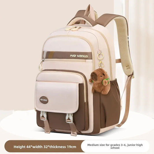 Children's school backpack with cartoon pendant
