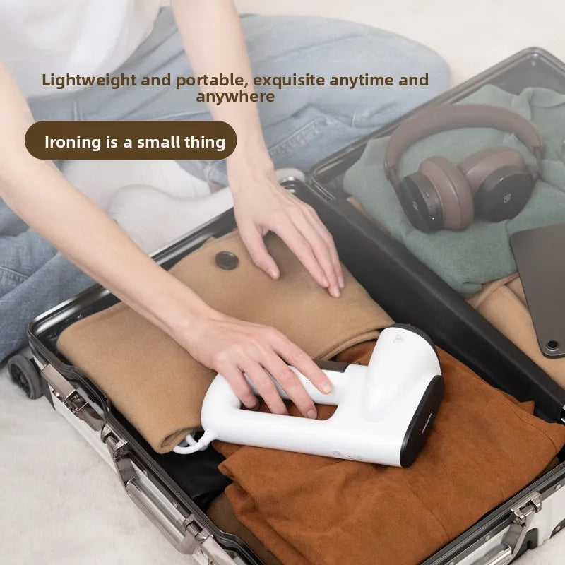 Portable steam iron with strong suction